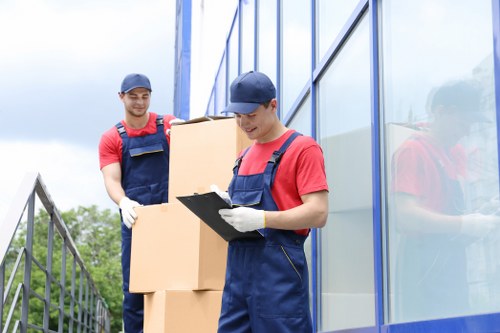 Professional movers loading items carefully into a van