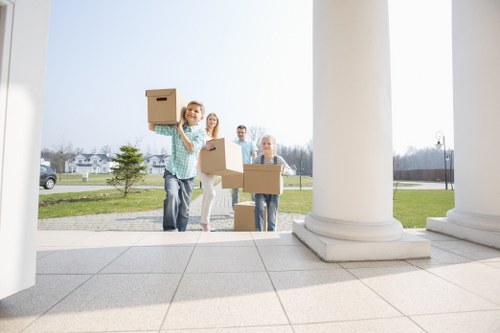 Moving van service vehicle loading household items for transport