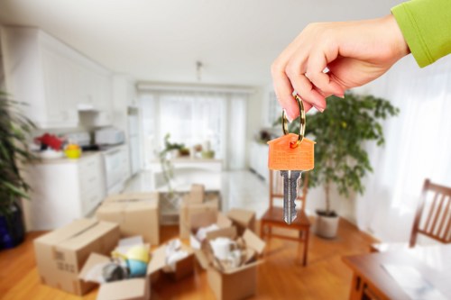 Professional movers handling office equipment in New Addington