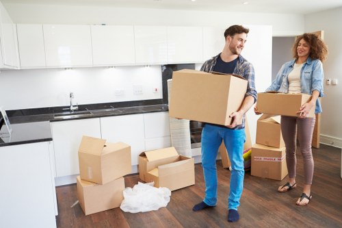 Local moving team handling boxes and household items