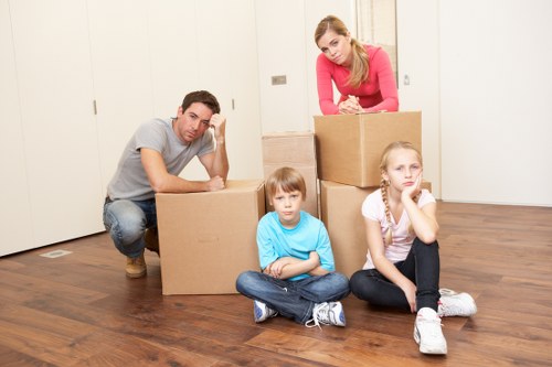 Packed boxes and furniture ready for house movers