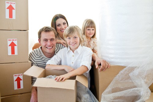 Helper carrying furniture during a man with a van job