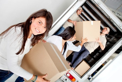 Packed boxes and furniture prepared for transport in a removal truck